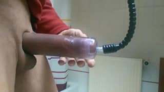 Sexy guy using a pump on his big cock Sexy guy using a pump on his big cock
